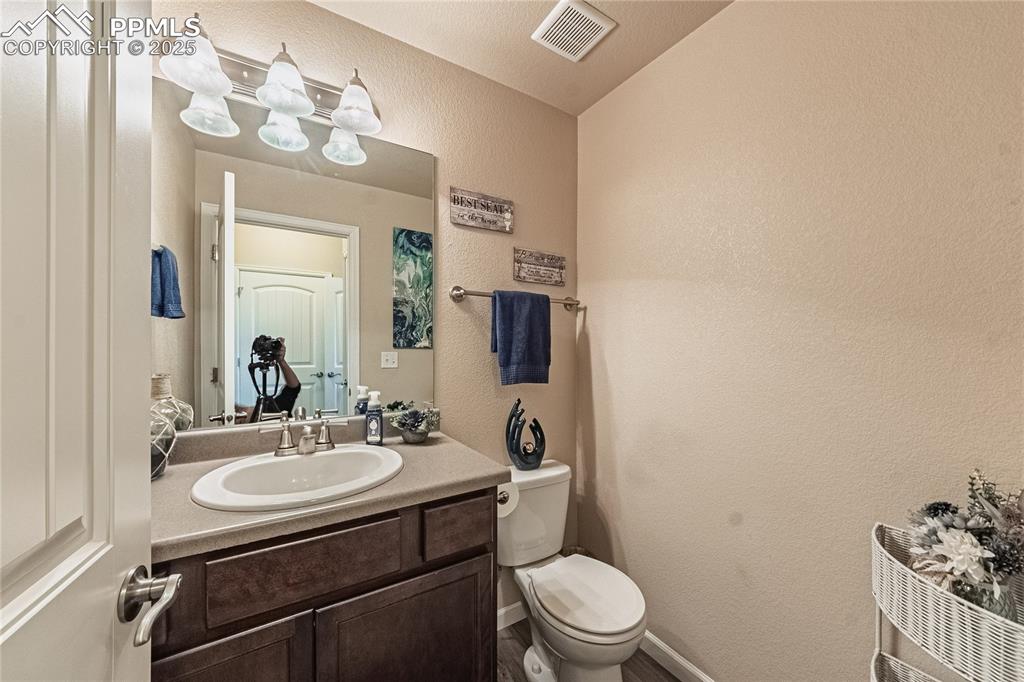 Image 15 of 33: Bathroom on main floor off the living room area.