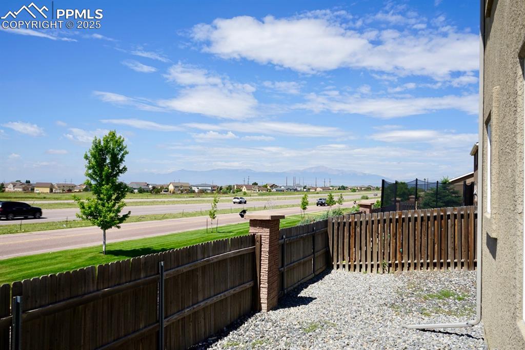 Image 33 of 33: View of backyard with a mountain view