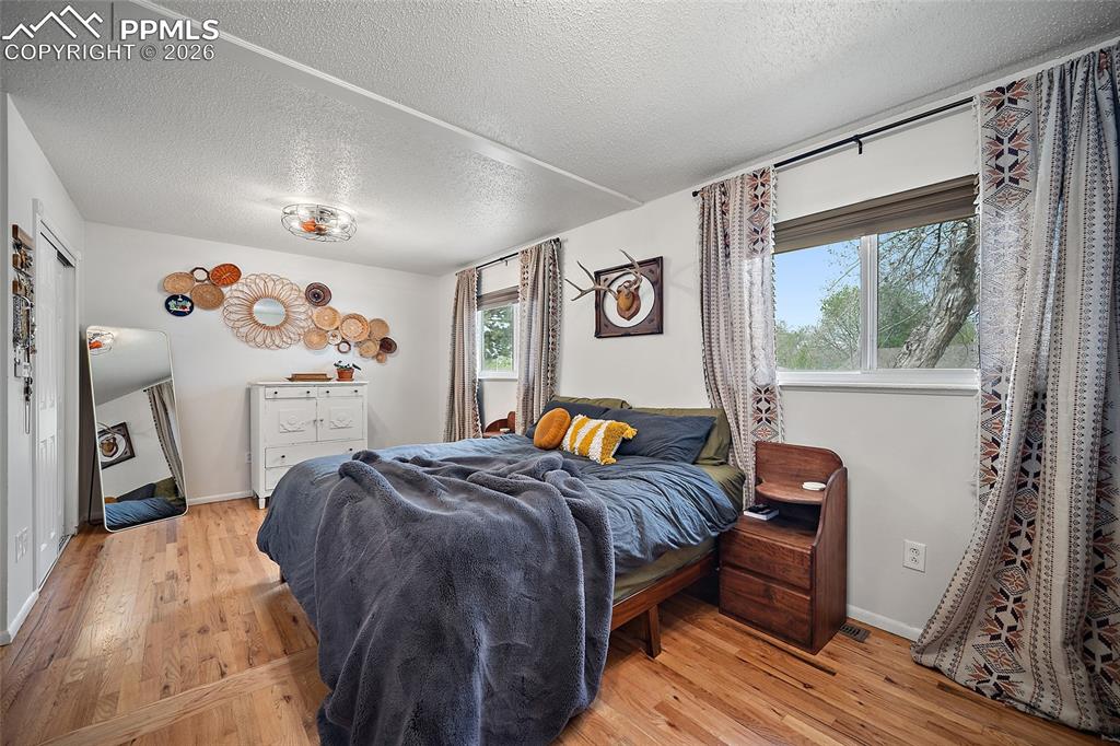 Image 17 of 49: oversized primary bedroom with two closets