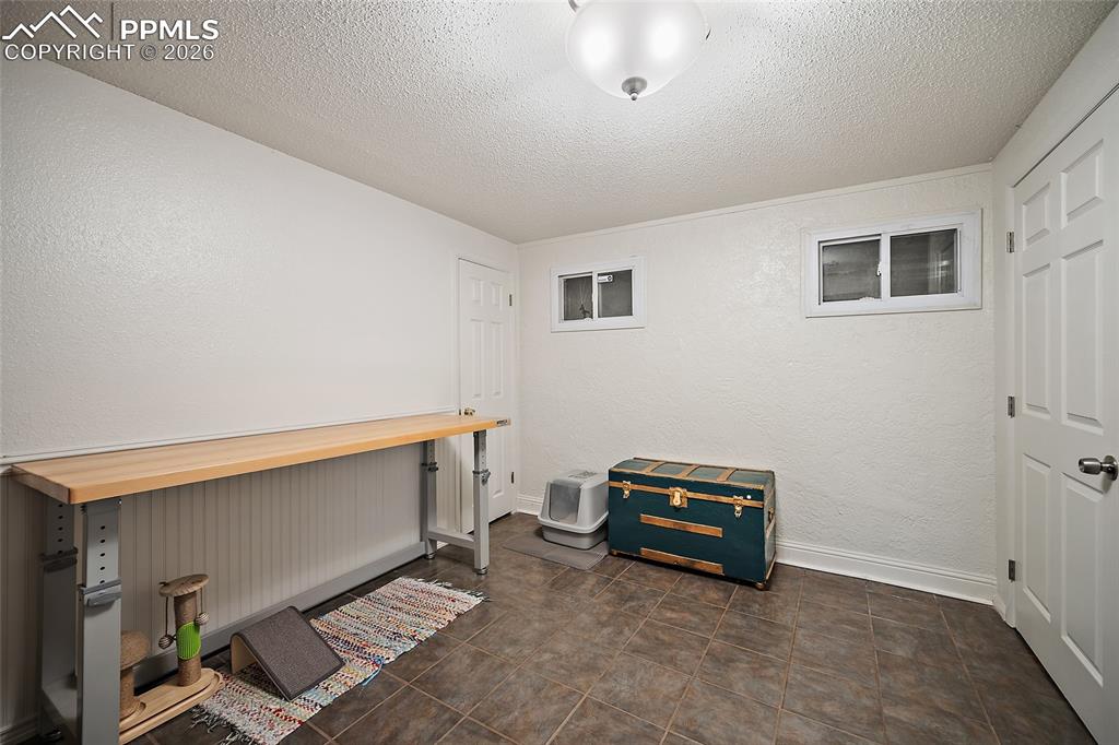 Image 32 of 49: fourth bedroom or office / storage in the basement