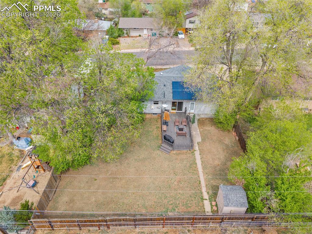 Image 42 of 49: aerial view of the backyard