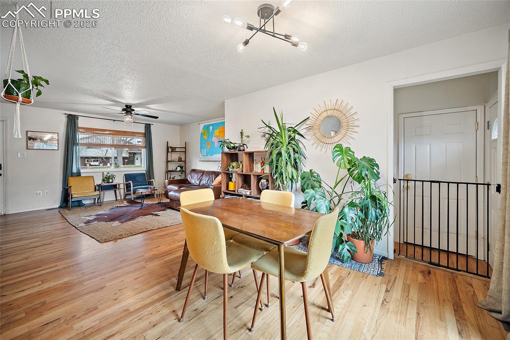 Image 8 of 49: Dining area with real wood floors