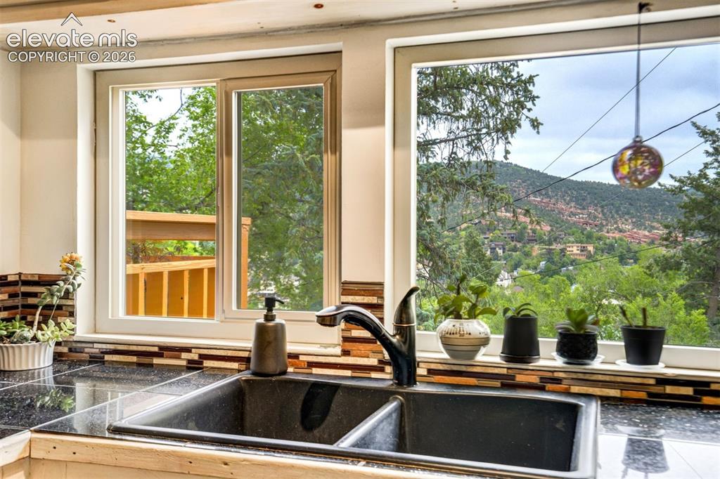 Image 9 of 30: View of Cliff Dwellings Through Kitchen Window
