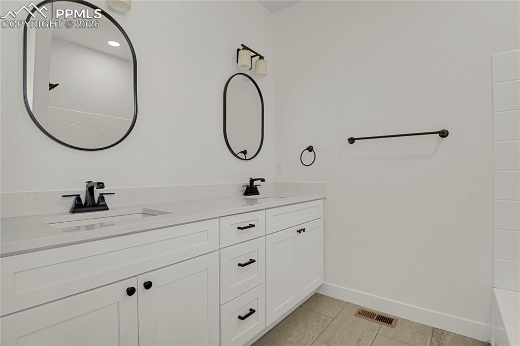 Image 19 of 29: This image shows the same model with alternate finishes. Actual home is cur