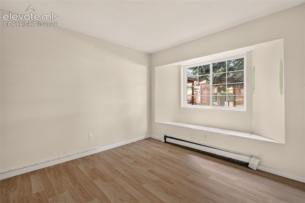 Image 8 of 17: Fun and bright box seat window in the bedroom