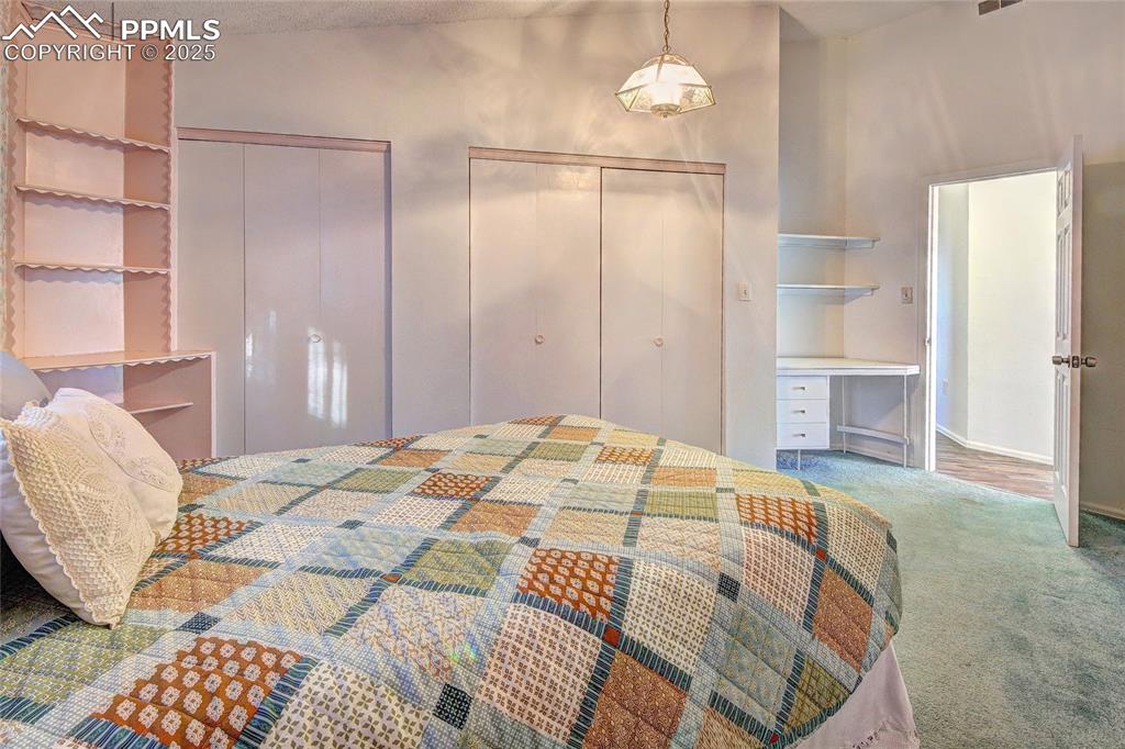 Image 15 of 33: Bedroom 2 with two closets and carpet