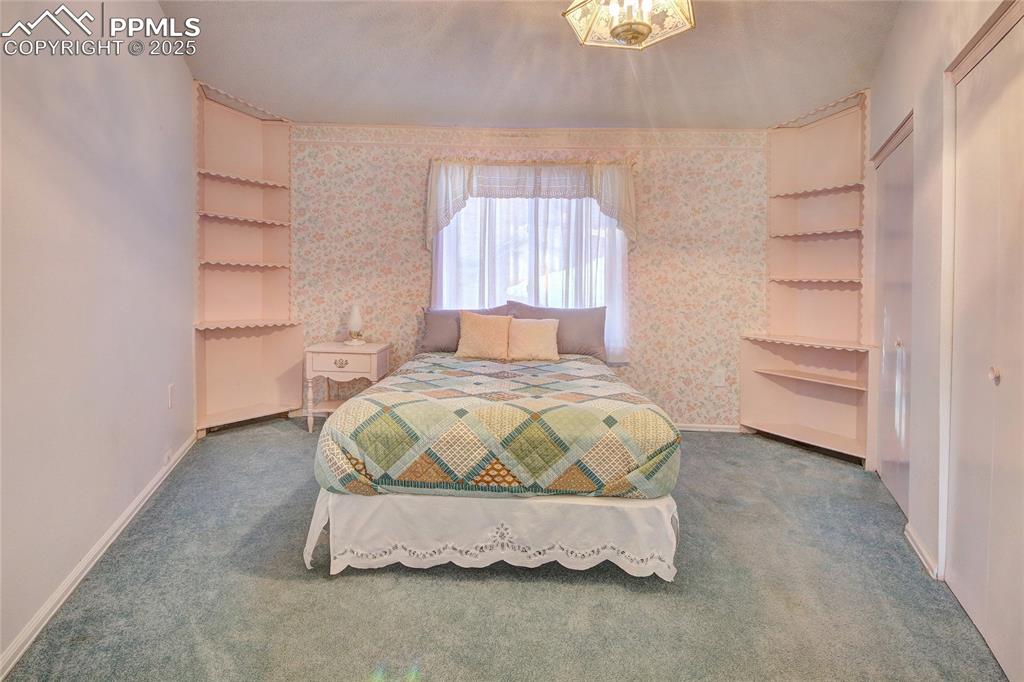 Image 16 of 33: Carpeted bedroom 2 featuring baseboards