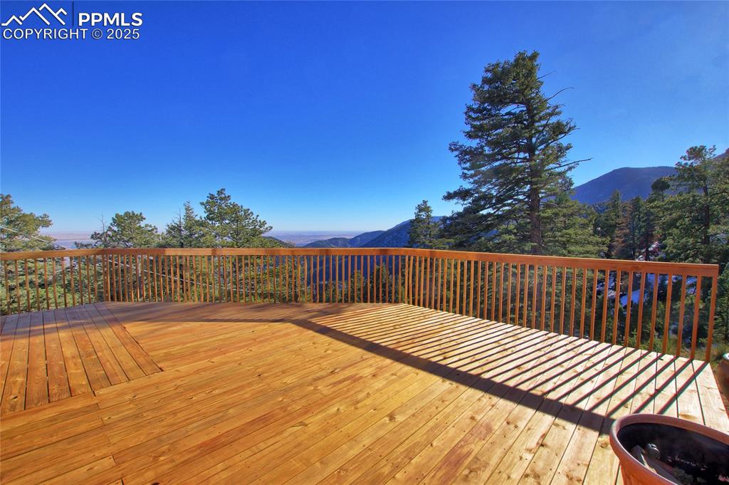 Image 25 of 33: Wooden deck featuring a mountain view