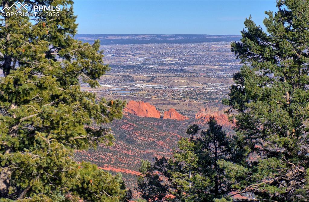 Image 30 of 33: Outside the Dining Room view of South Central Colo. Springs with a mountain
