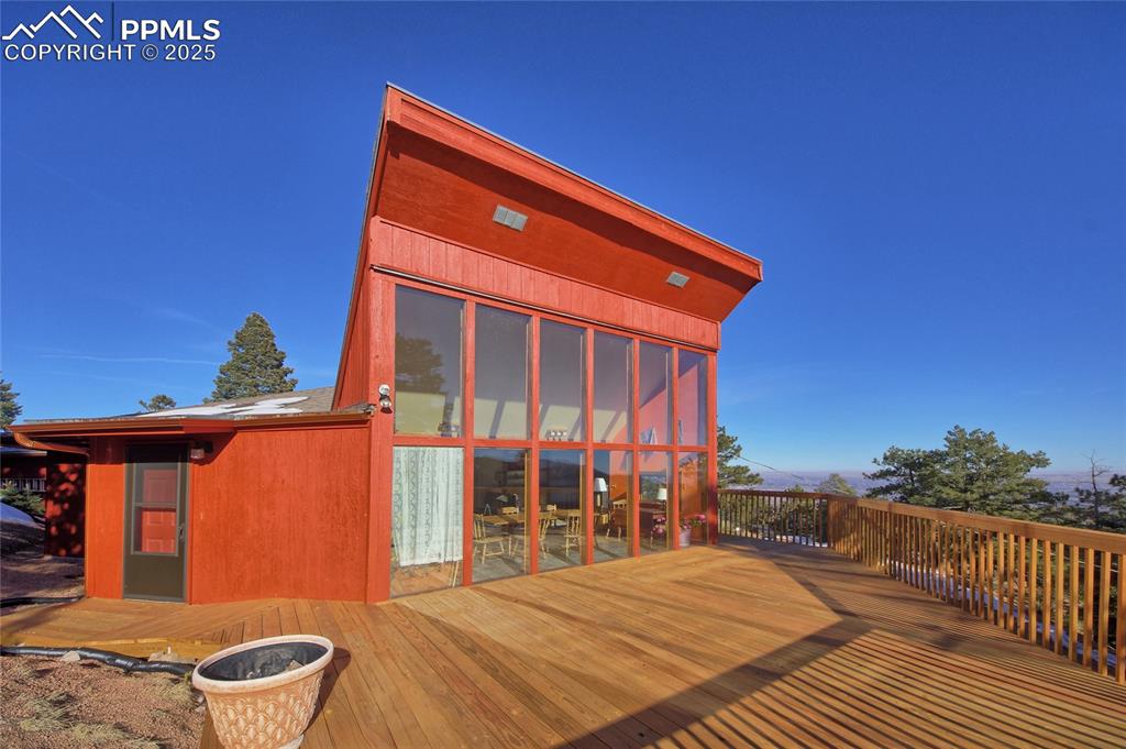 Image 4 of 33: Rear view of house with a deck