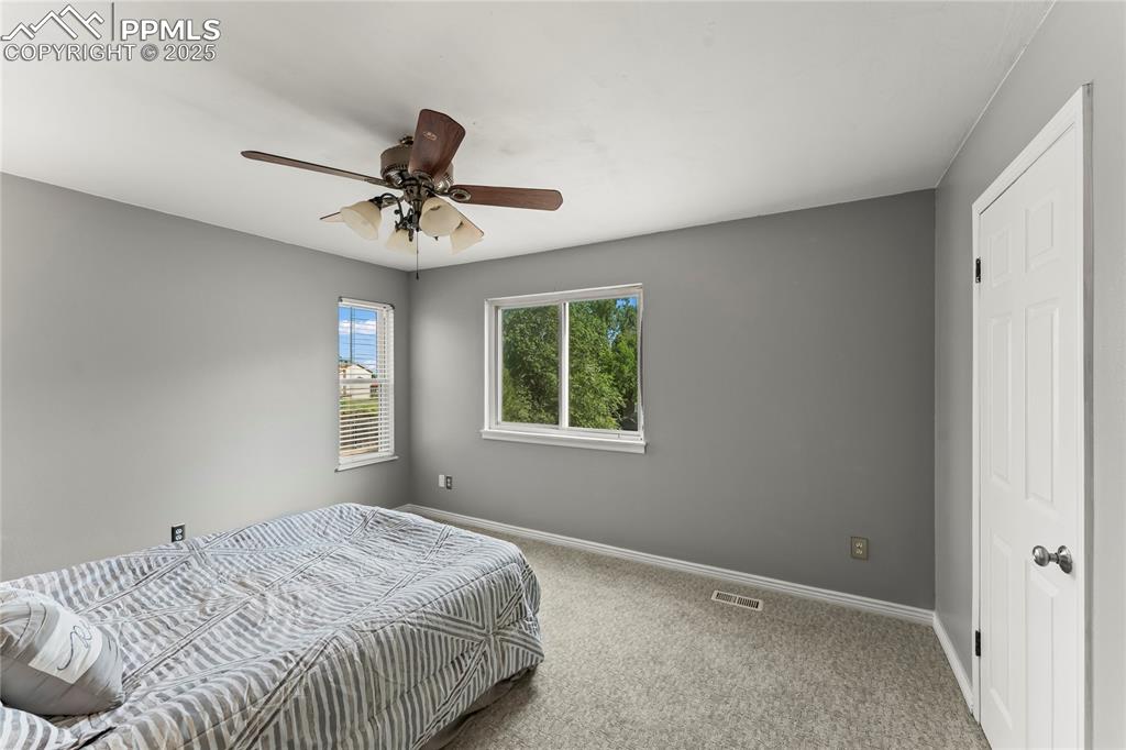 Image 15 of 21: Upper level second bedroom
