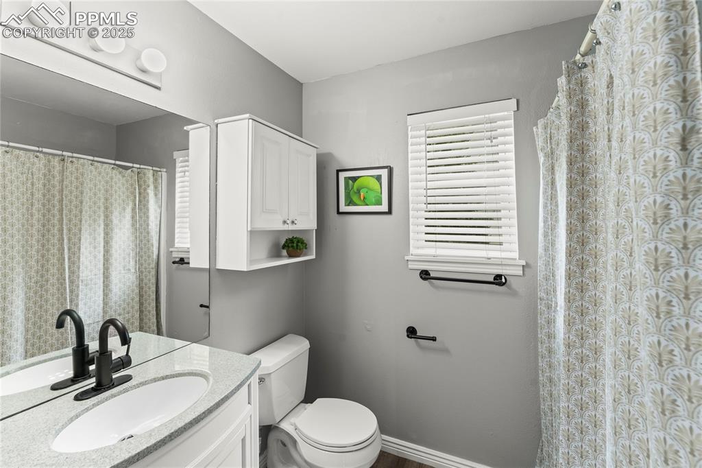 Image 16 of 21: Full Bath adjacent to Primary Bedroom and second bedroom