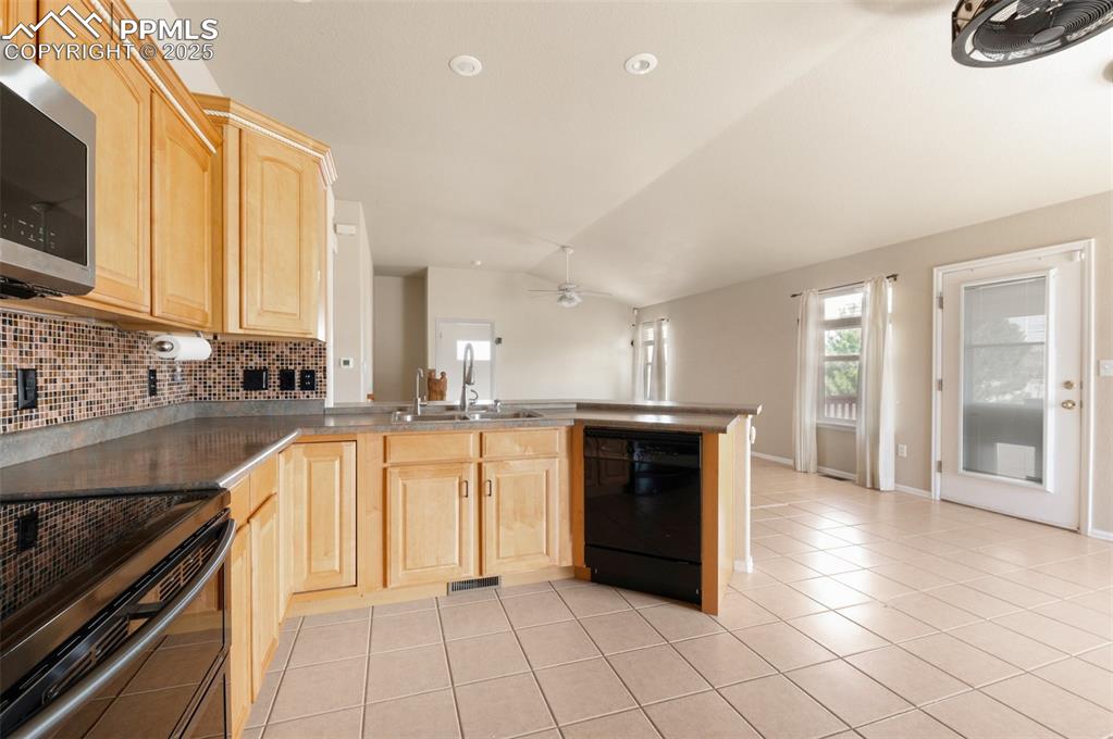 Image 13 of 43: Kitchen has ample cabinets