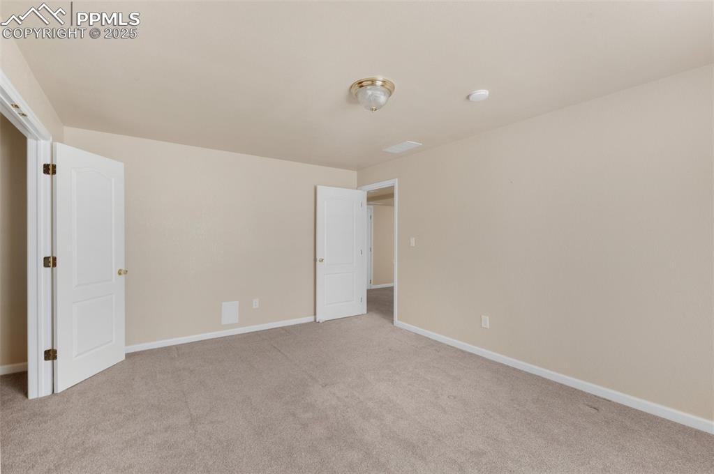 Image 33 of 43: Basement bedroom