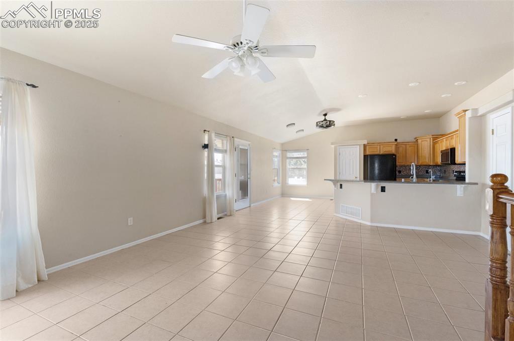 Image 8 of 43: Vaulted Ceilings in Kitchen/living room area