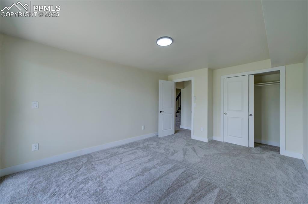 Image 44 of 50: Basement bedroom