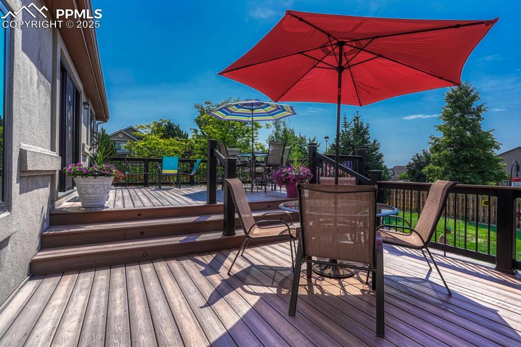 Image 40 of 50: Deck with outdoor dining area