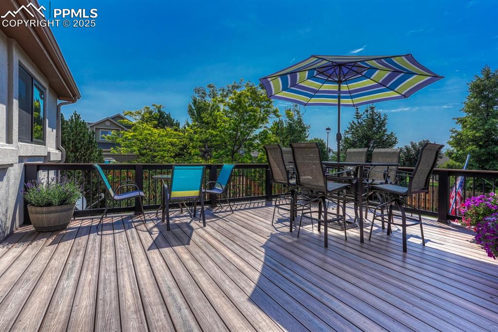 Image 41 of 50: Wooden terrace featuring outdoor dining space