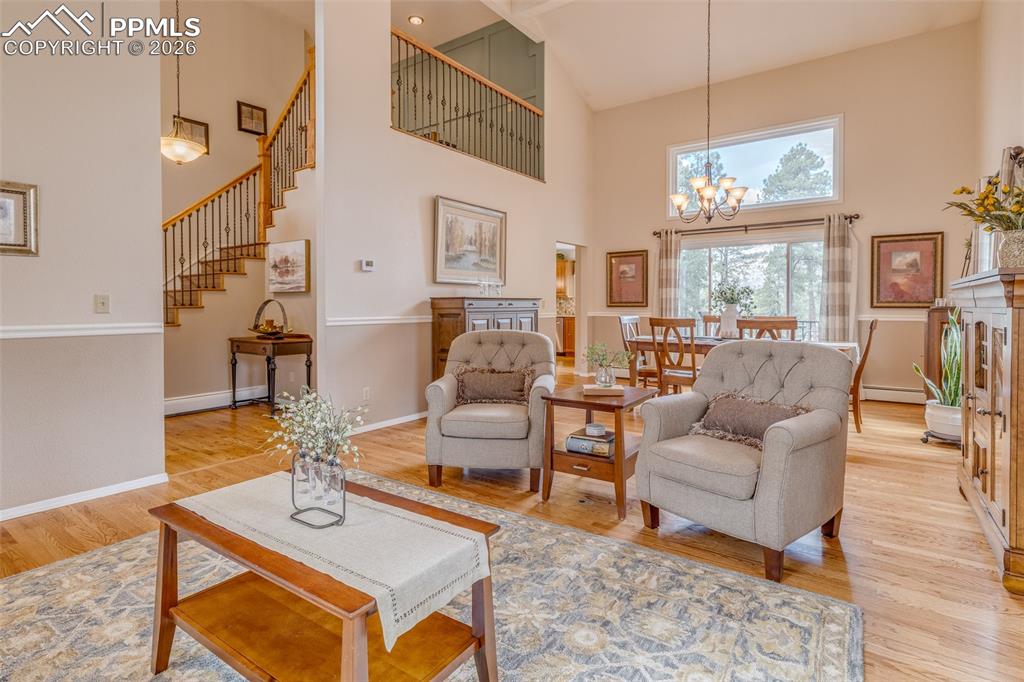 Image 13 of 50: Living room looking into dining room