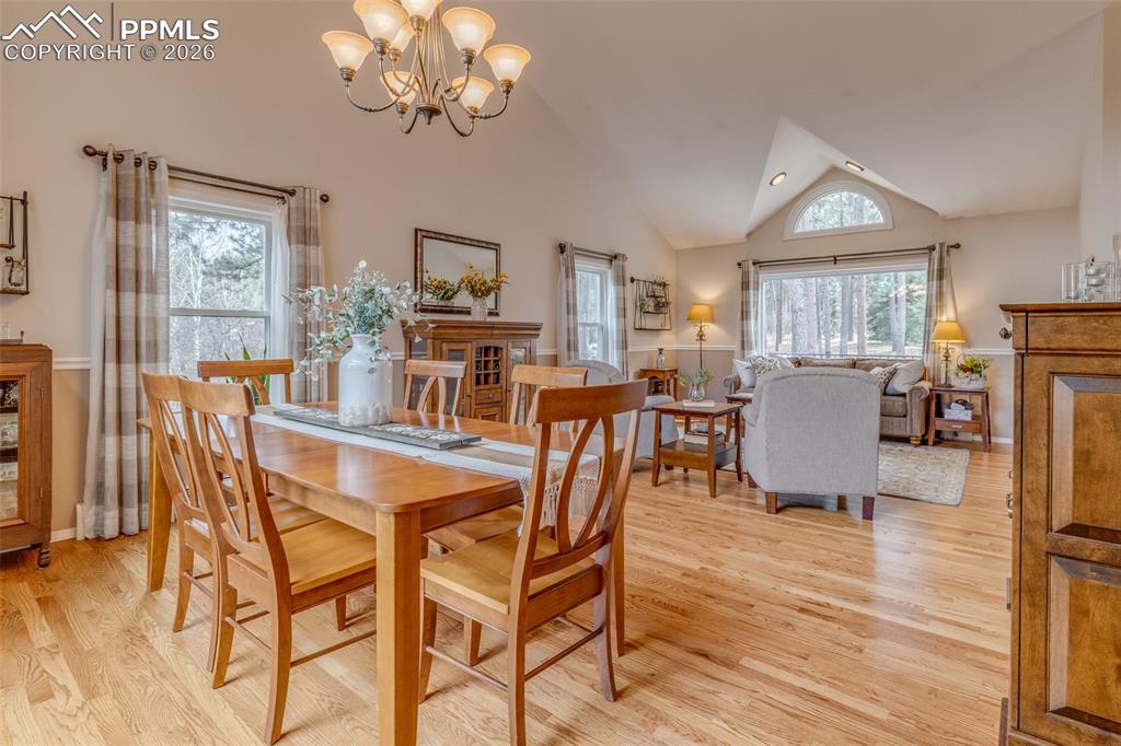 Image 15 of 50: 	
	
Spacious formal dining and living room with wood flooring