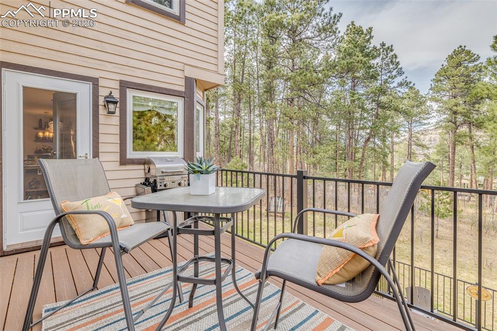 Image 19 of 50: Balcony off the kitchen, enjoy the beautiful outside