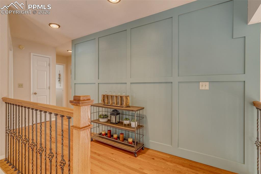 Image 24 of 50: Upstairs with custom paneling