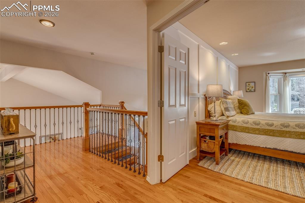 Image 25 of 50: Double doors into primary from the staircase