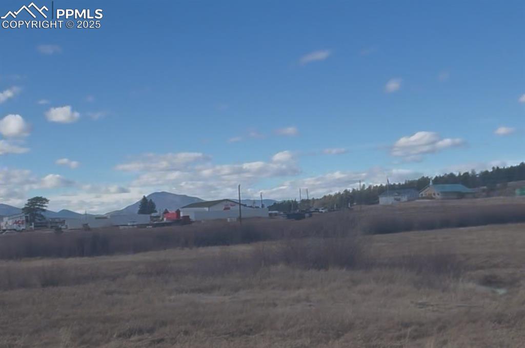 Image 2 of 2: View of yard with a mountain view