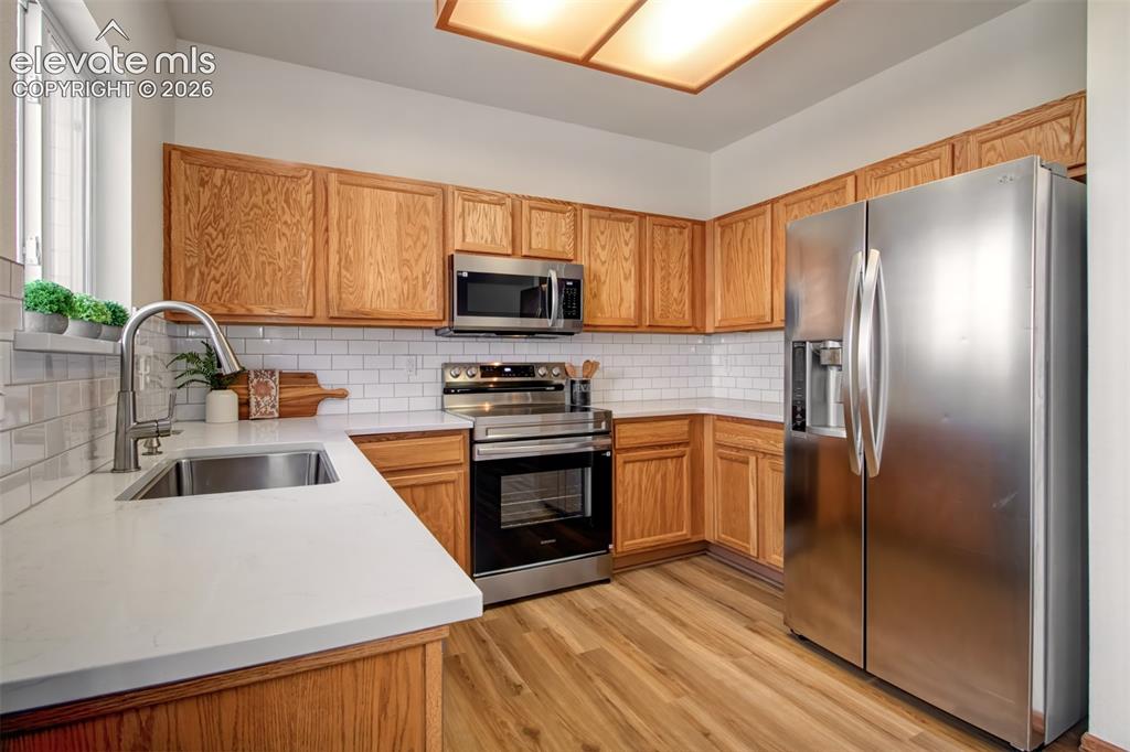 Image 11 of 37: Beautiful kitchen with new Quartz countertops, new backsplash, new sink, ne