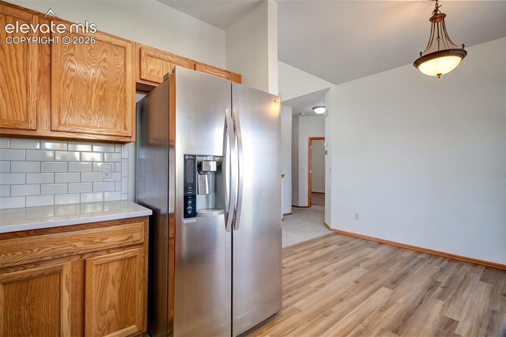 Image 12 of 37: View from kitchen looking toward dining area.