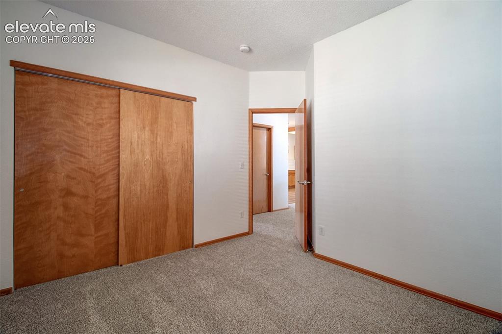 Image 19 of 37: Main-level secondary bedroom.