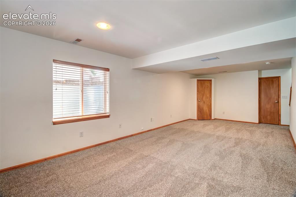 Image 22 of 37: Basement-level family room... endless uses for this room.