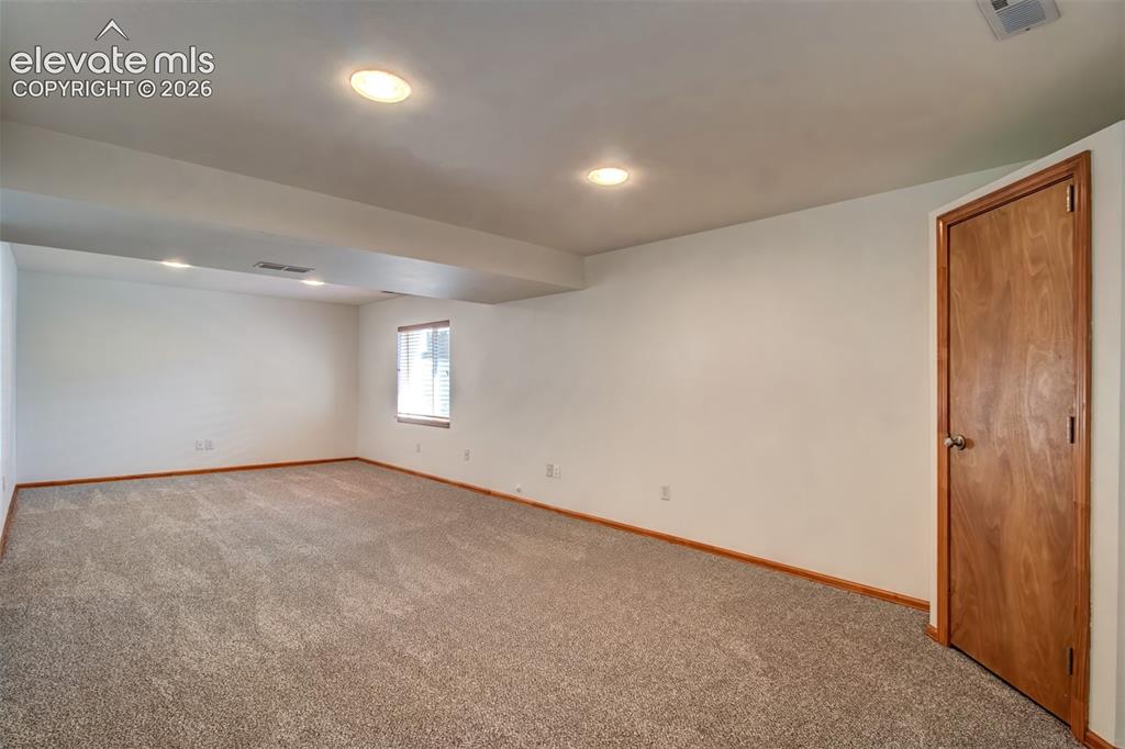 Image 25 of 37: Basement-level family room.