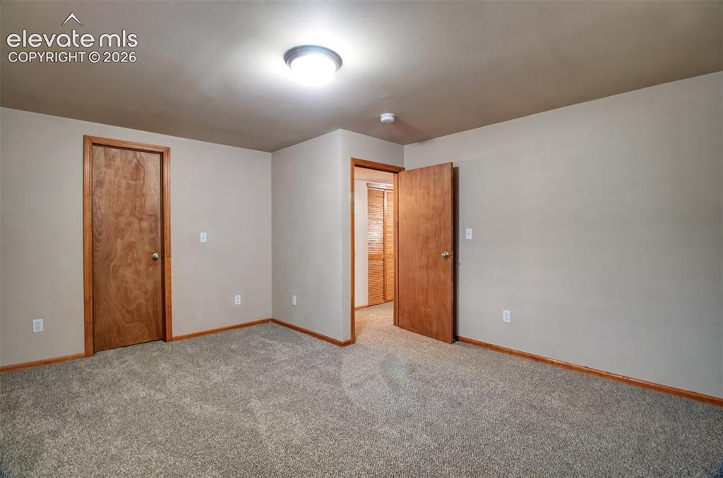 Image 28 of 37: Another view of secondary basement bedroom. This room also has a very large