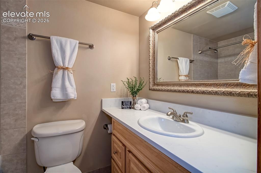 Image 31 of 37: Beautiful basement bathroom with new quartz countertop, extra deep soaking 