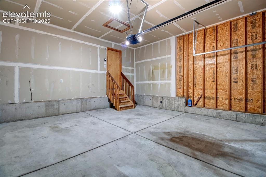 Image 32 of 37: Two-car attached garage with opener. 