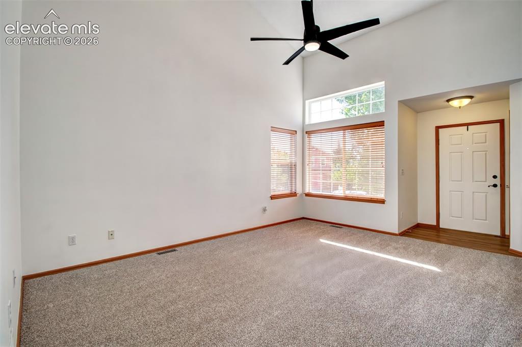 Image 6 of 37: You can see there is lots of natural light that shines into this living roo