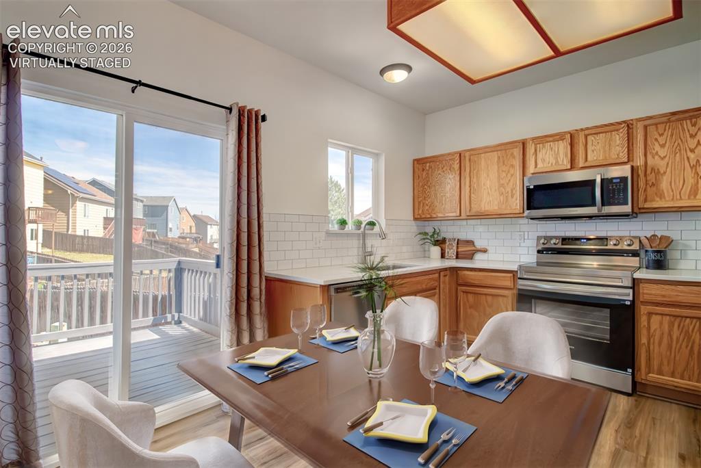 Image 9 of 37: Virtually Staged dining area.