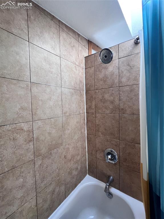 Image 9 of 21: Primary shower/tub