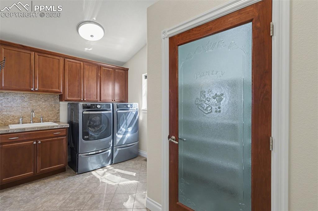 Image 14 of 50: Large Walk-In Pantry, Laundry Area & Utility Sink