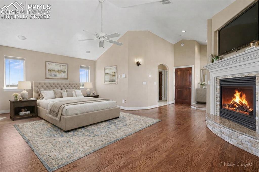 Image 21 of 50: Virtually Staged - Primary Bedroom w/Fireplace, Balcony and 5-Piece Walk-in