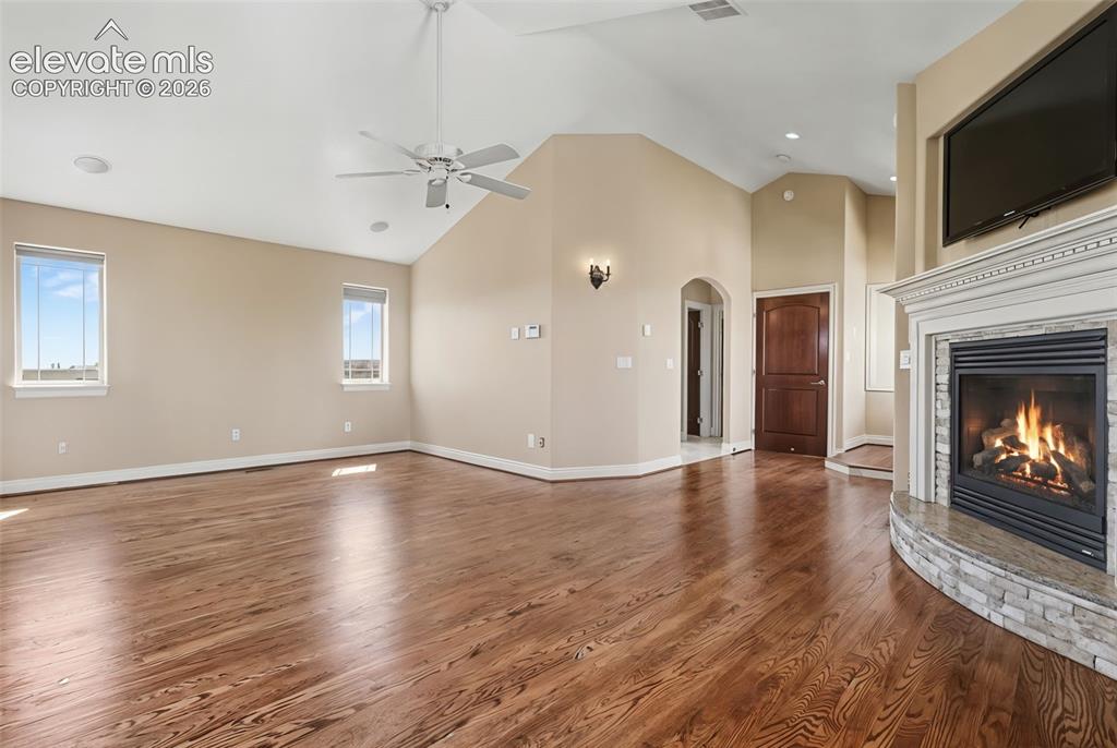Image 22 of 50: Primary Bedroom w/Fireplace, Balcony and 5-Piece Walk-in Bath
