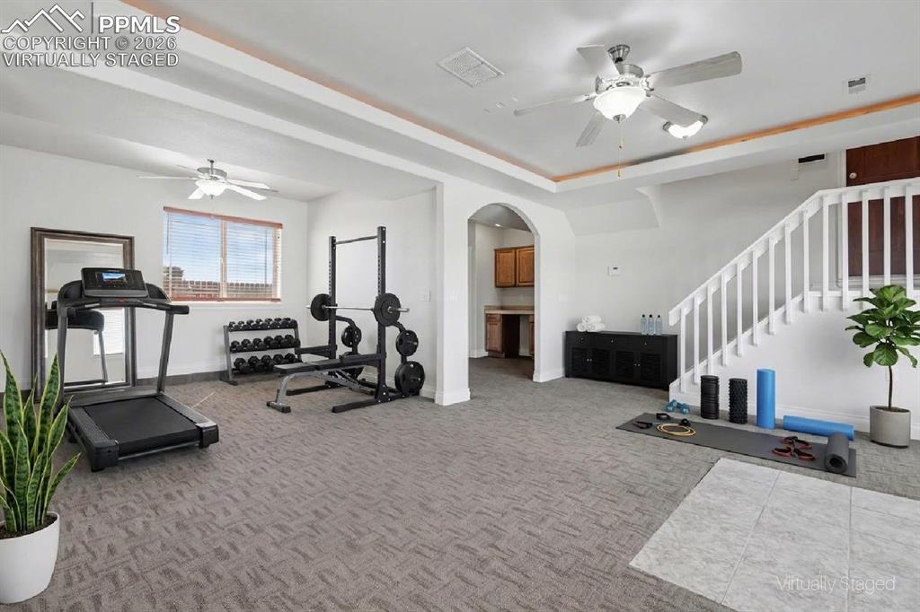 Image 29 of 50: Virtually Staged - Walk-Out Rec Room to Firepit