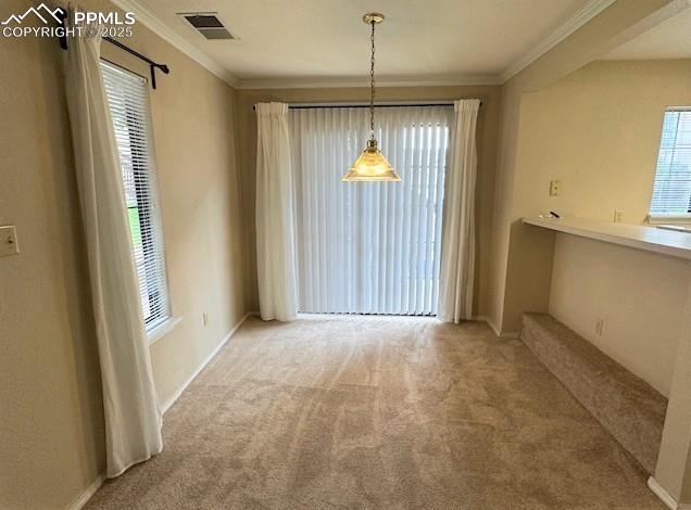 Image 11 of 32: Dining area featuring brand new light colored carpet, stylish light fixture