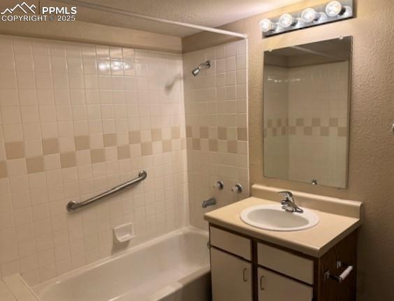 Image 22 of 32: Full bath featuring bathing tub / shower combination and vanity storage