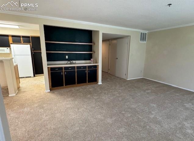 Image 7 of 32: Living room featuring storage cabinets and decorative shelving