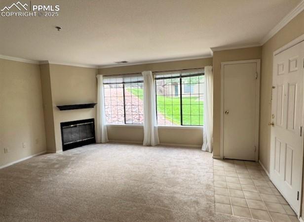 Image 8 of 32: Living room and entry view from dining room and with crown molding and larg