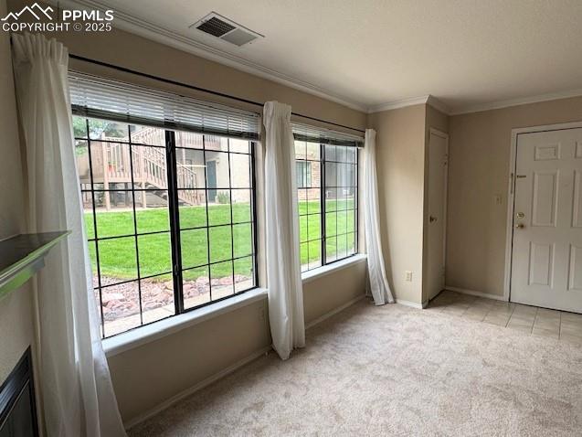 Image 9 of 32: Living room view towards entry, entry closet, tile flooring and bright wind