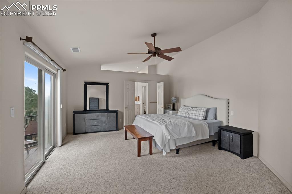 Image 19 of 40: Primary bedroom with primary ensuite and balcony.