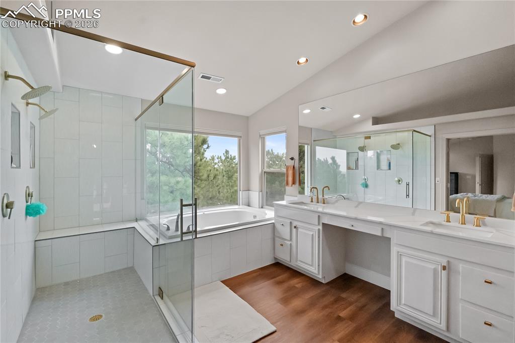 Image 20 of 40: Double vanity, double rain shower heads, frameless glass shower, jetted tub